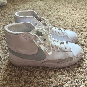 white and blue Nike Blazers